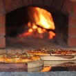 Pizza oven and delicious fresh pizza